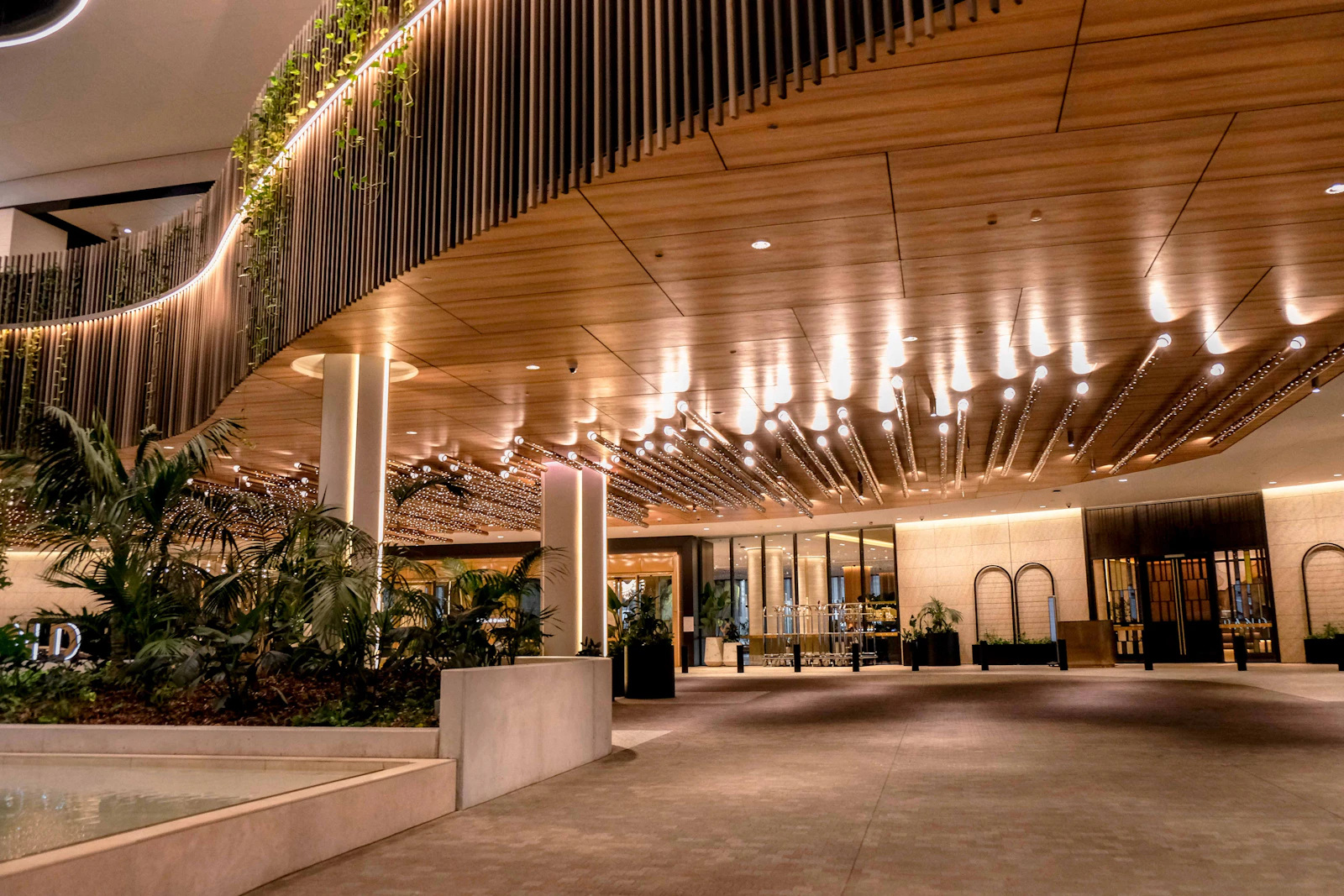 Luxury hotel entrance facade with premium stone-finish architectural coating on exterior walls, Philippines