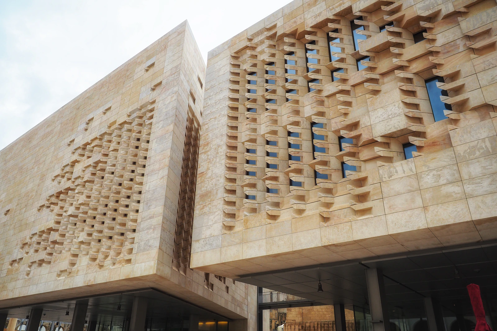Modern shopping mall entrance with premium stone-effect facade coating in the Philippines